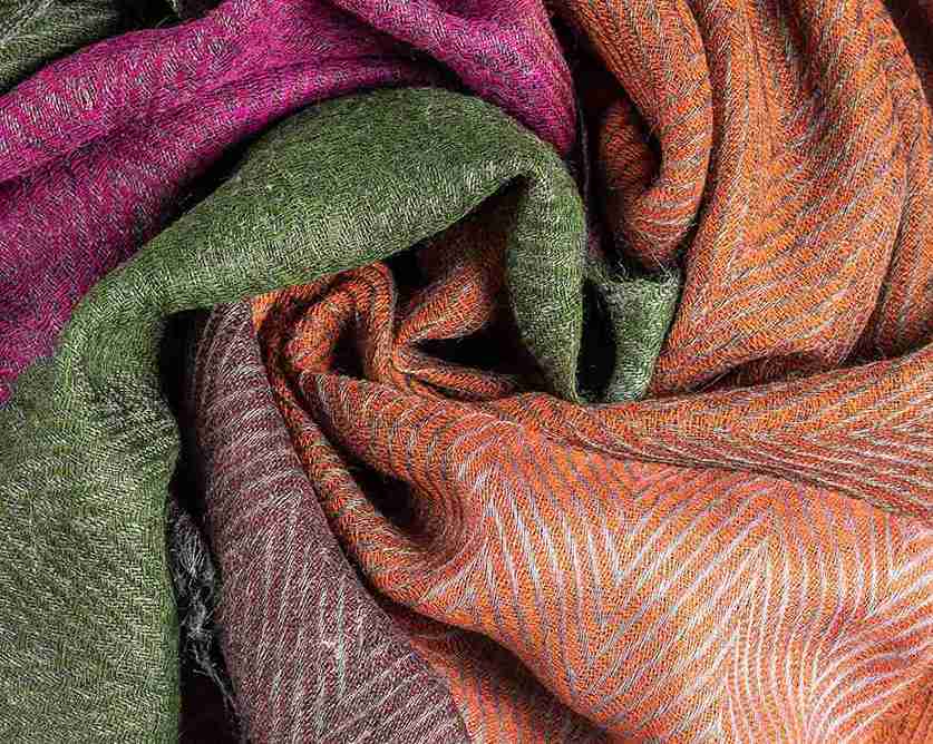 Artisan-crafted cotton tufted cushion with tassels, adding a touch of elegance to any living space from Divine Handicrafts