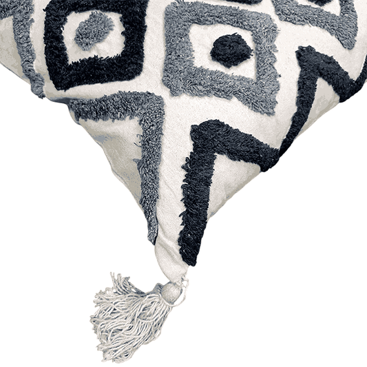 Decorative cotton cushion with geometric tufted pattern and tassel detail by Divine Handicrafts
