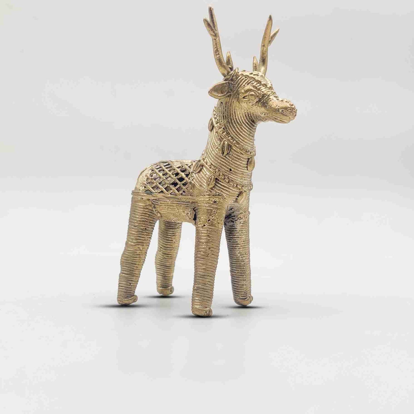 Handcrafted brass deer figurine in Dhokra art style, symbolizing prosperity and elegance