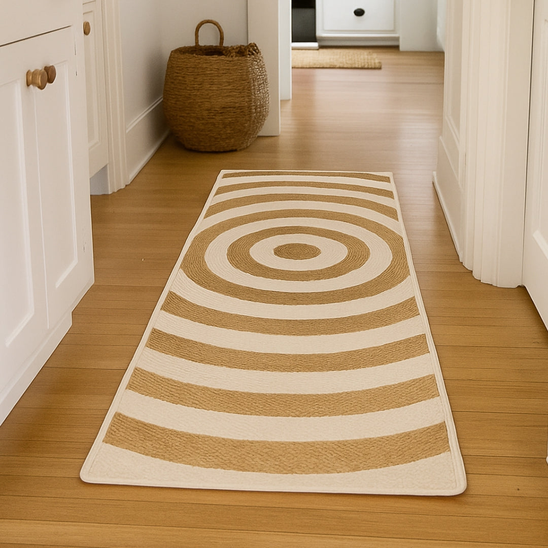 Long rectangular rug with concentric circle pattern on a wooden floor