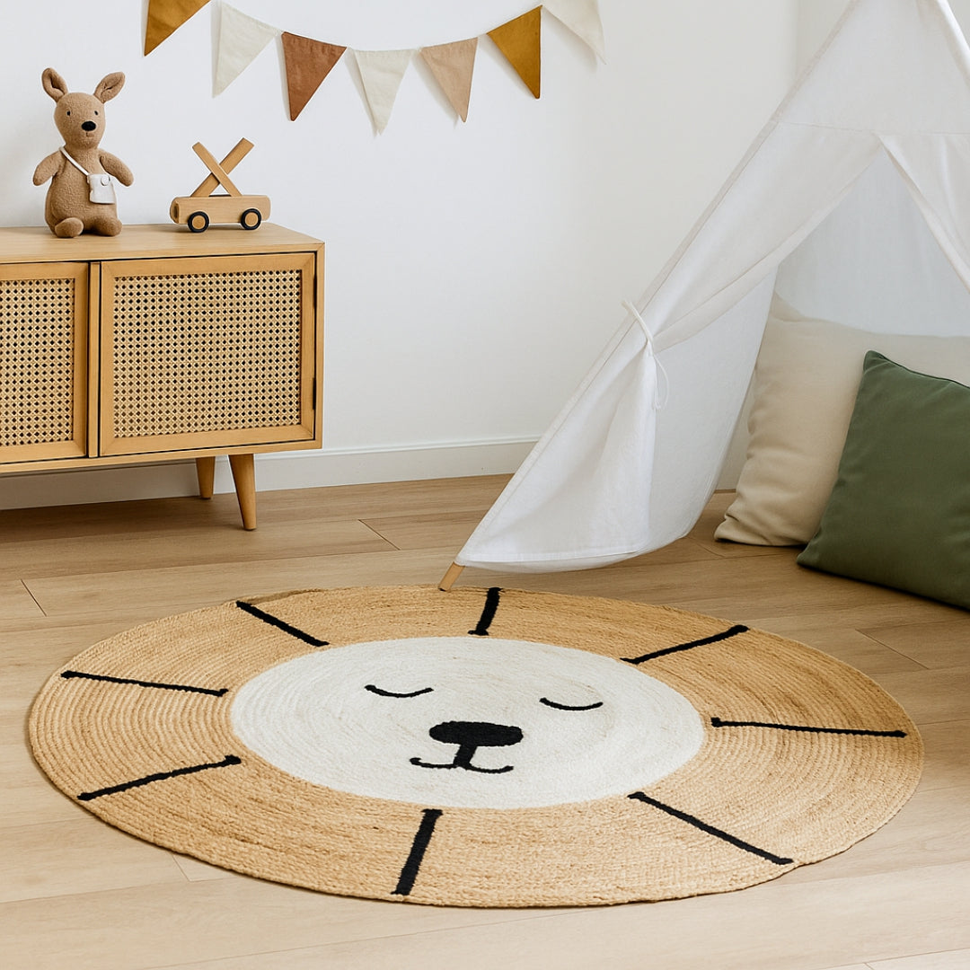 Round lion rug on a wooden floor with a wooden cabinet and toys in the background.