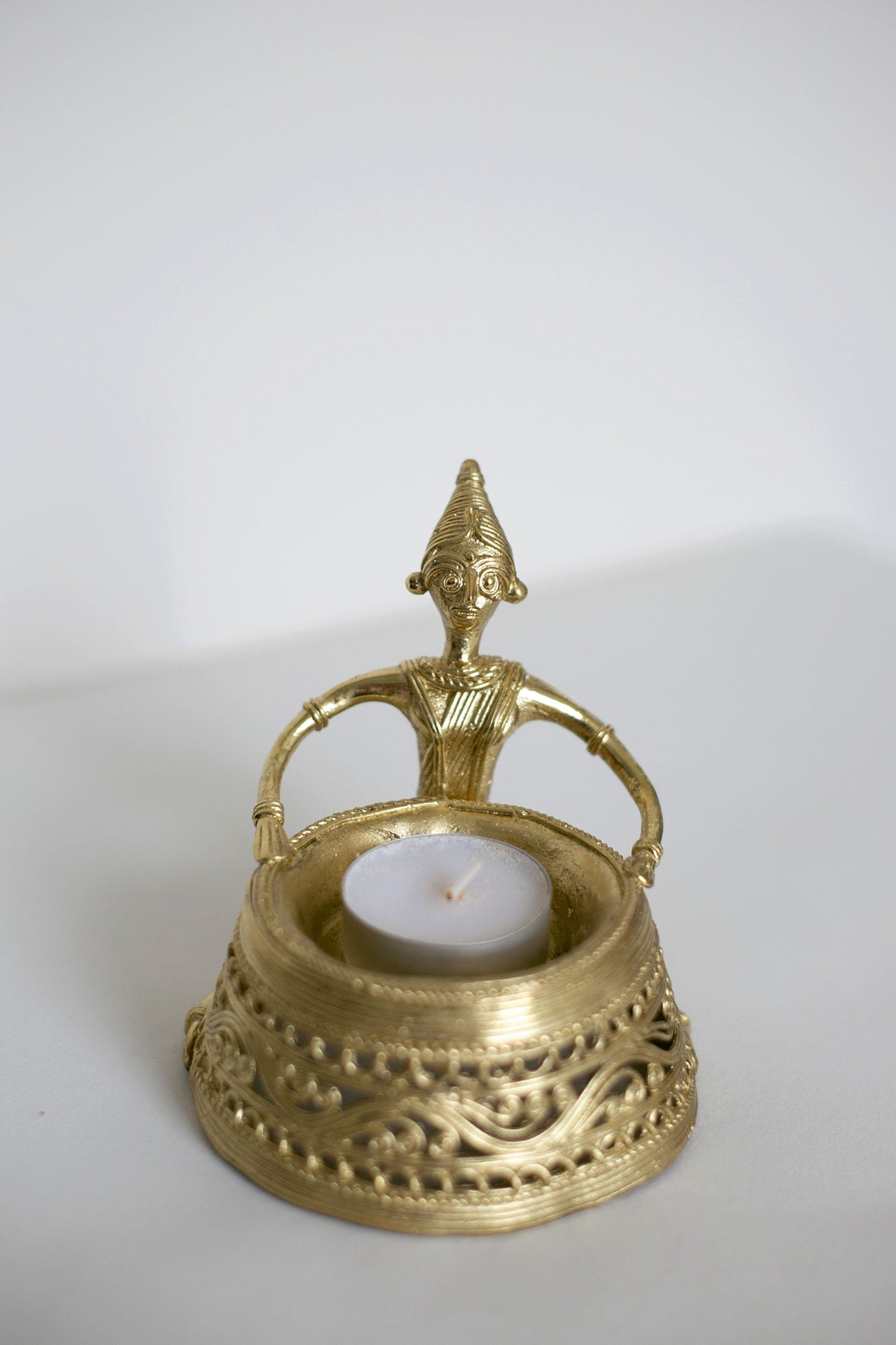 Antique style brass tealight holder with figurine handle