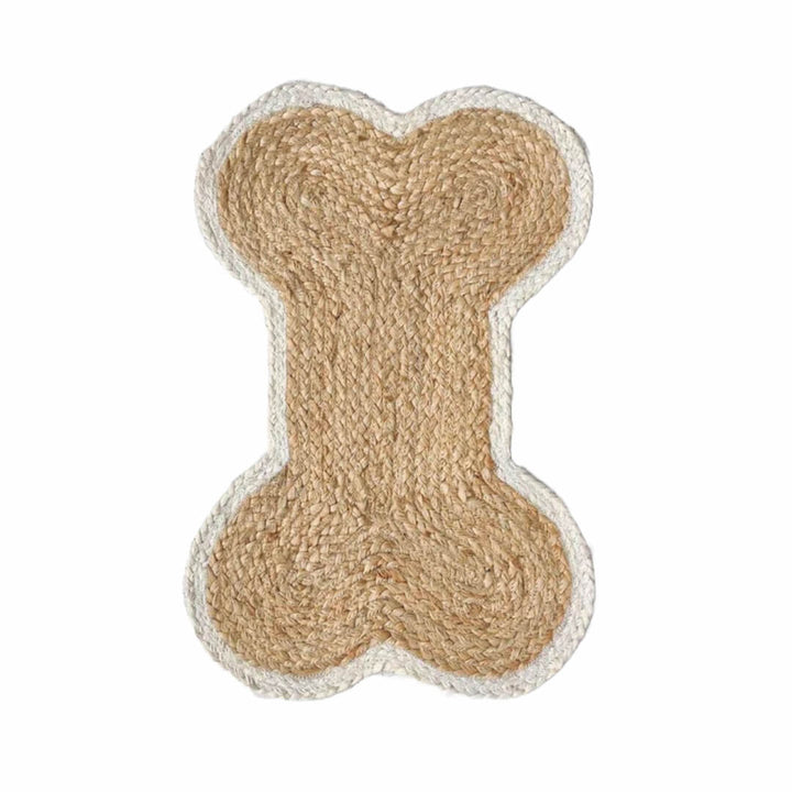 Dog bone-shaped toy made of natural material on a white background