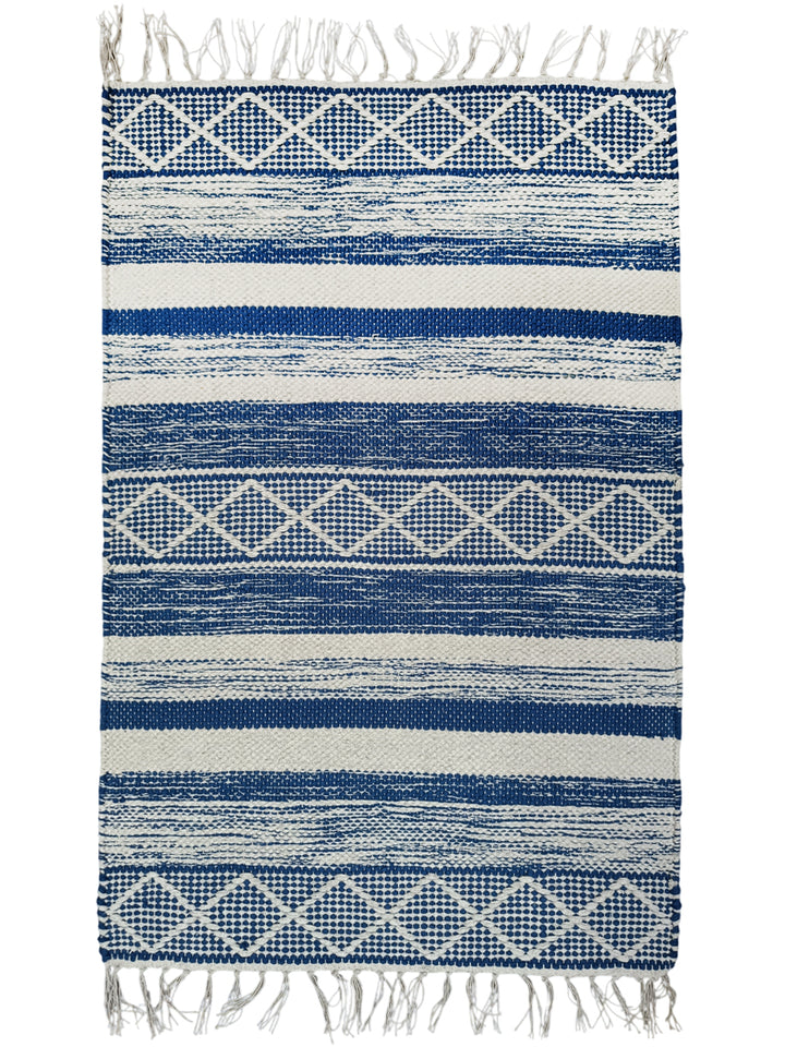 Blue and white striped rug with geometric patterns and fringes on a white background