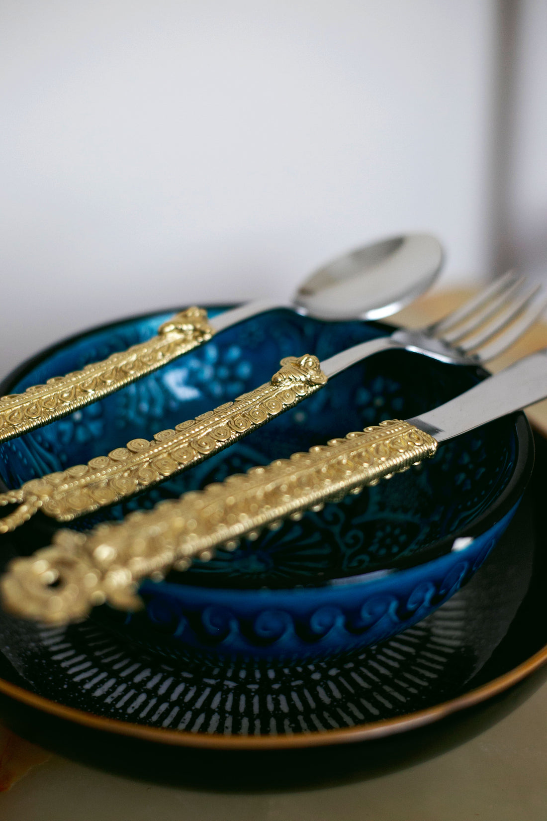 Ornate brass spoon fork knife set with carved handles