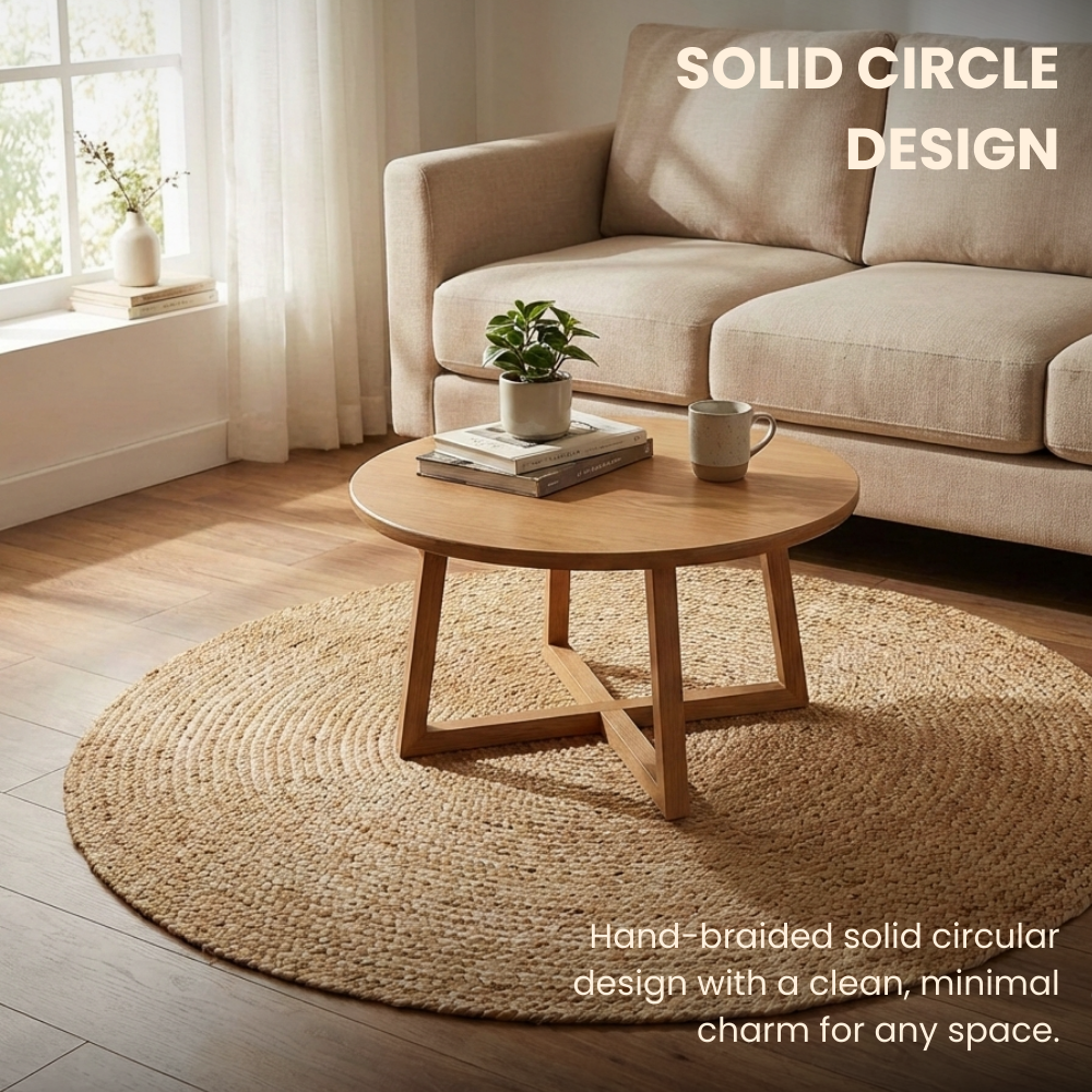 Living room with a beige sofa, wooden coffee table, and round jute rug.