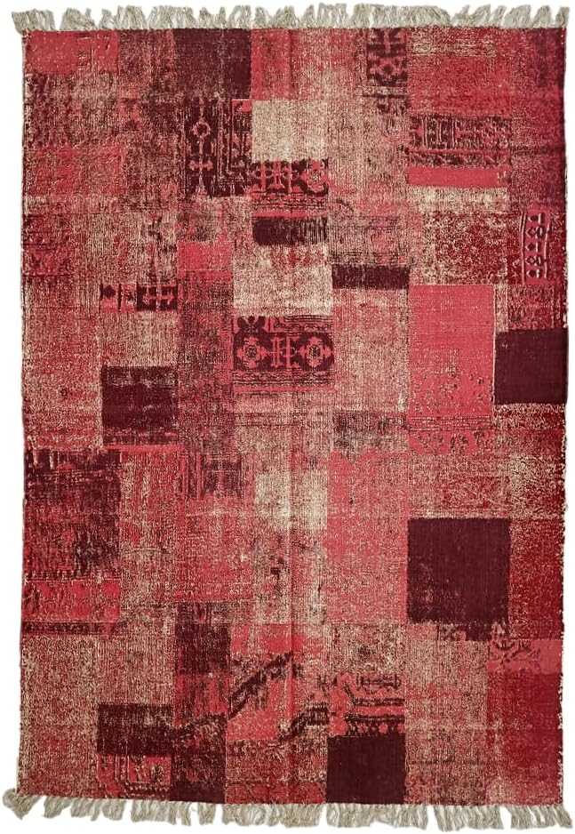 A rectangular cotton rug with a braided pattern featuring geometric and floral designs in a mix of red, beige, and brown colors.