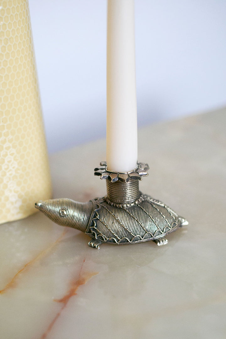 Antique-inspired turtle candlestick with textured shell design