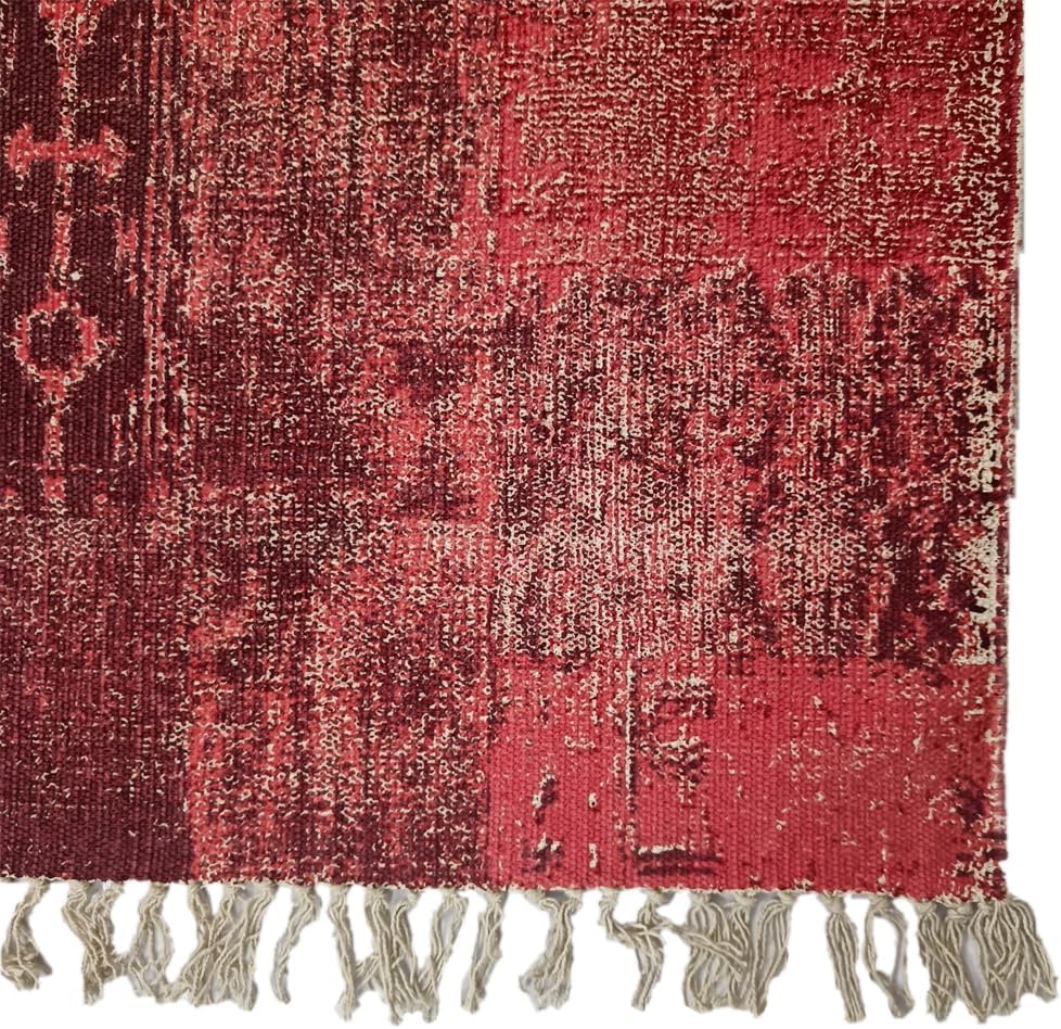Rectangular cotton braided rug with geometric and floral red, beige, and brown patterns