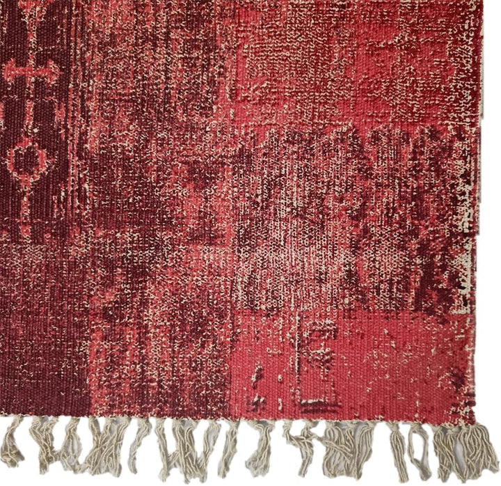 Rectangular cotton braided rug with geometric and floral red, beige, and brown patterns