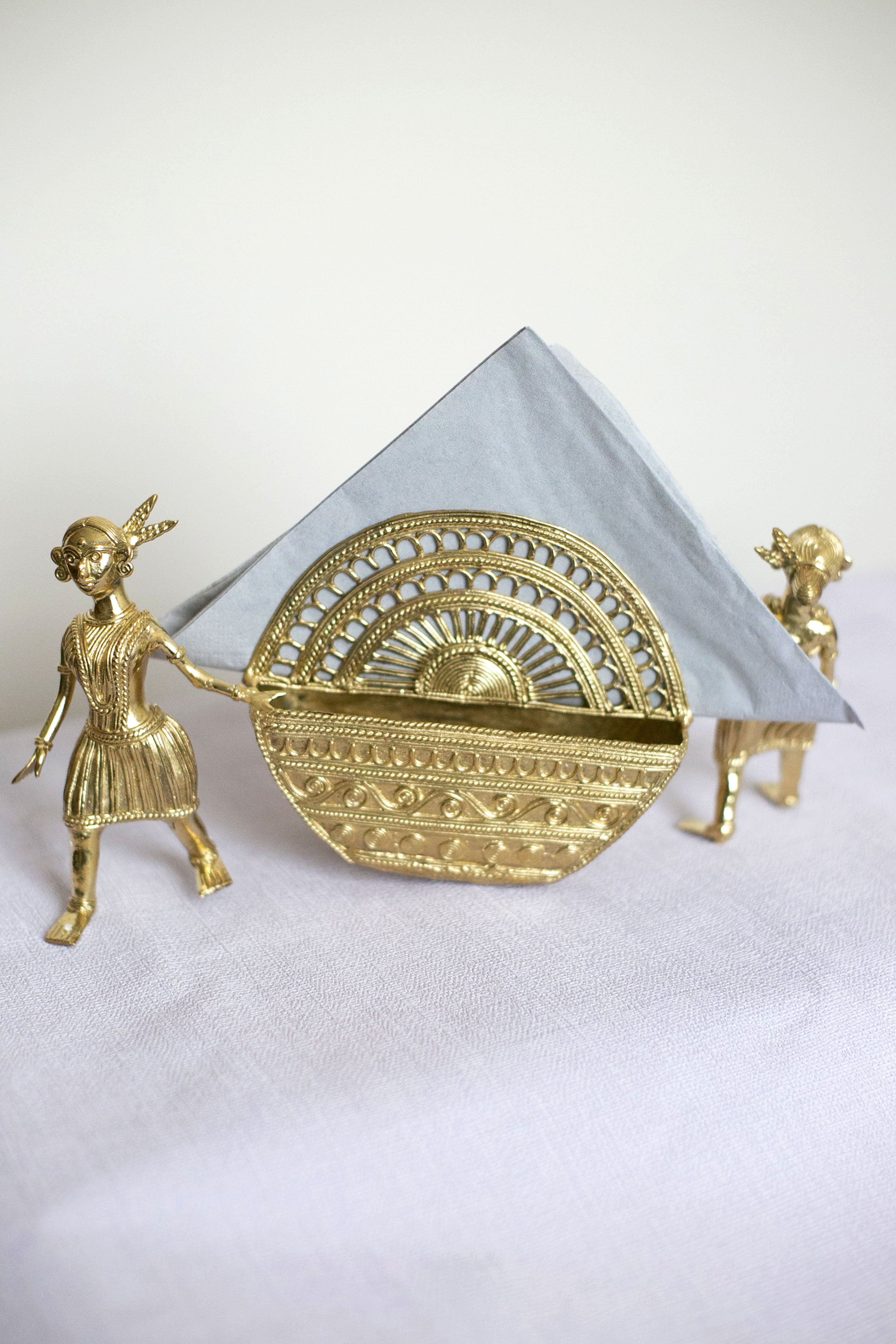 Antique-style gold container with decorative arch design