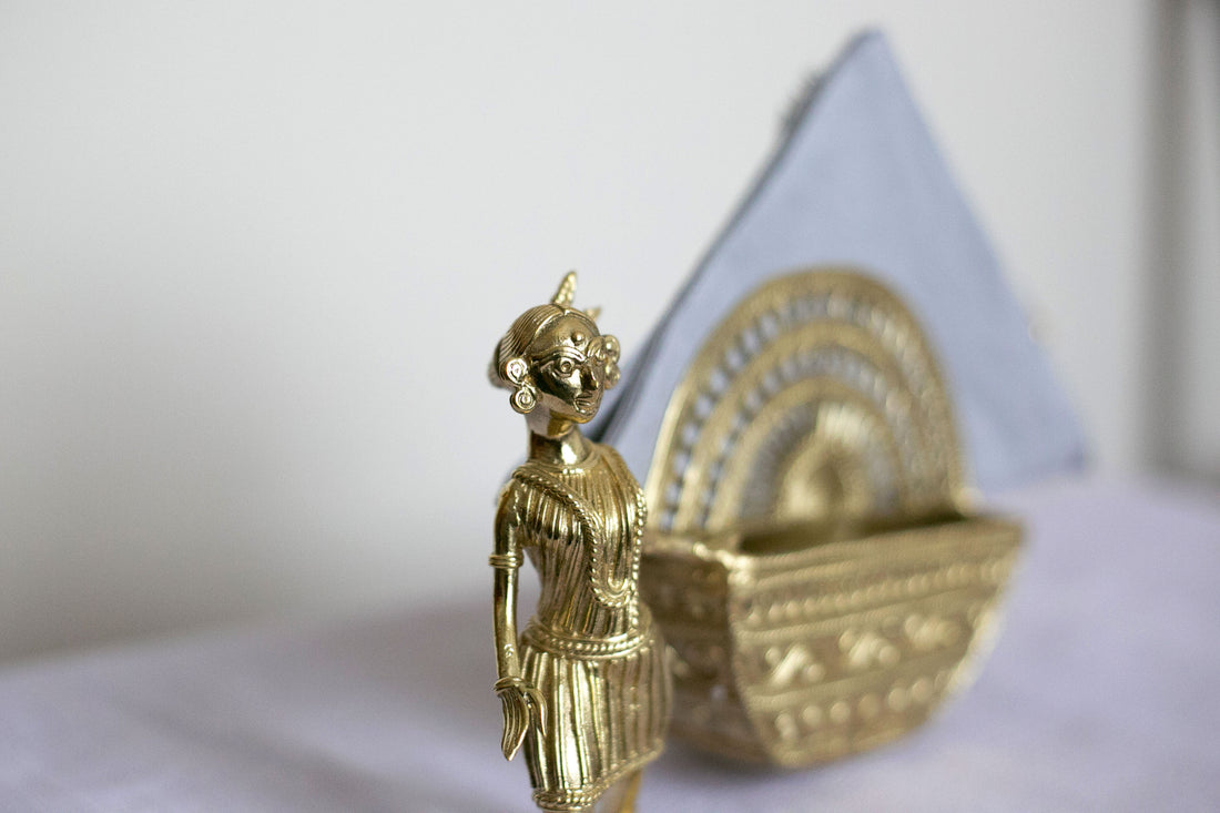 Vintage-inspired metal basket with ornate carvings