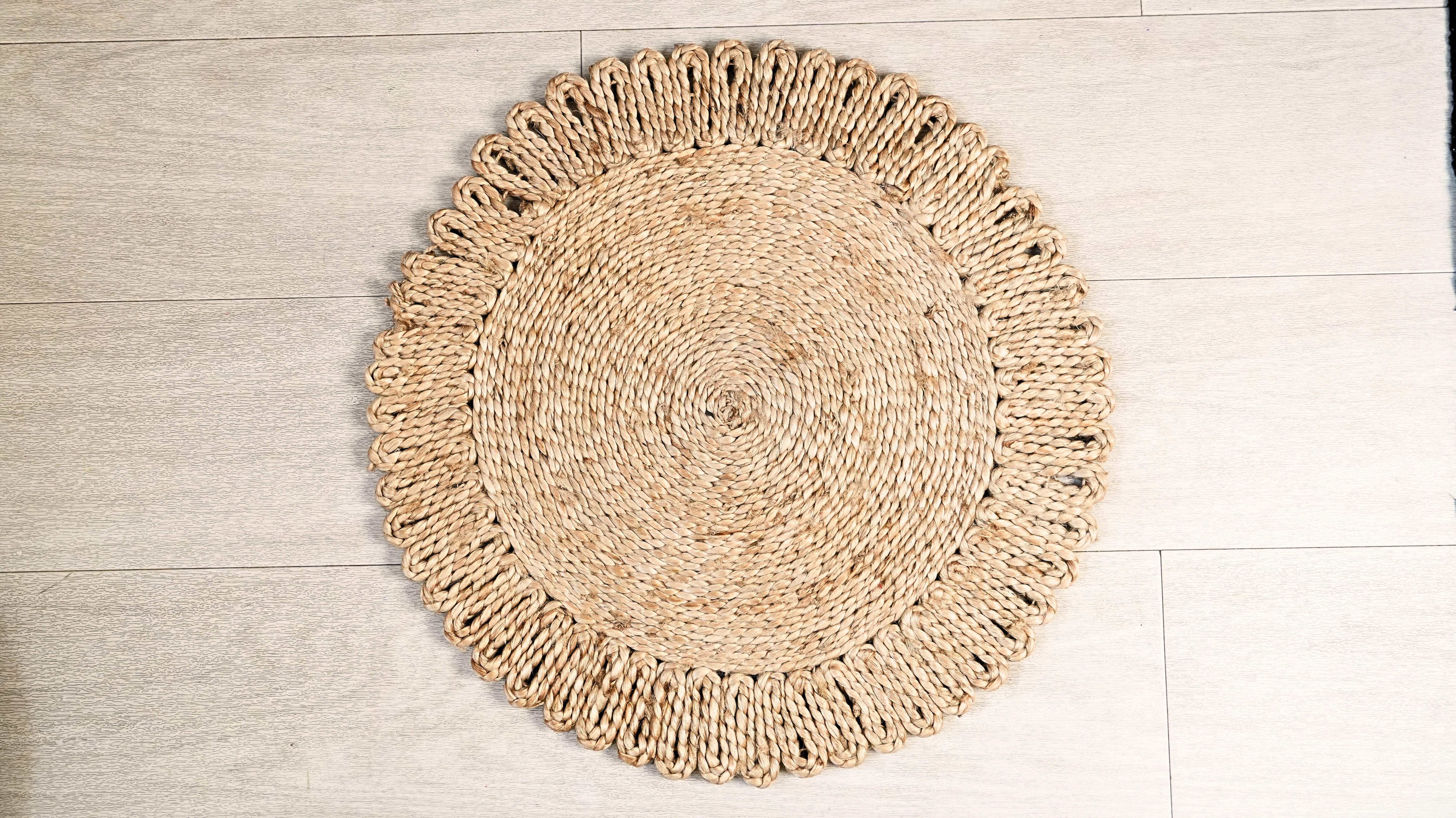 Round woven mat on a wooden floor