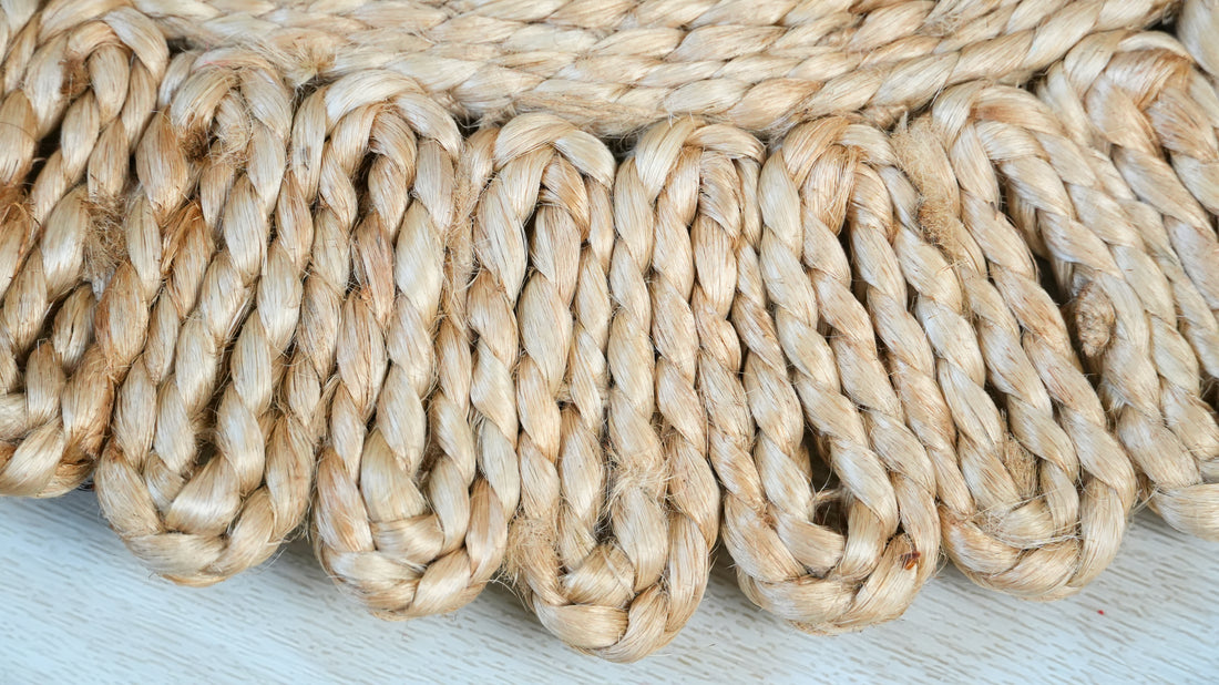 Close-up of braided beige rope on a light wooden surface