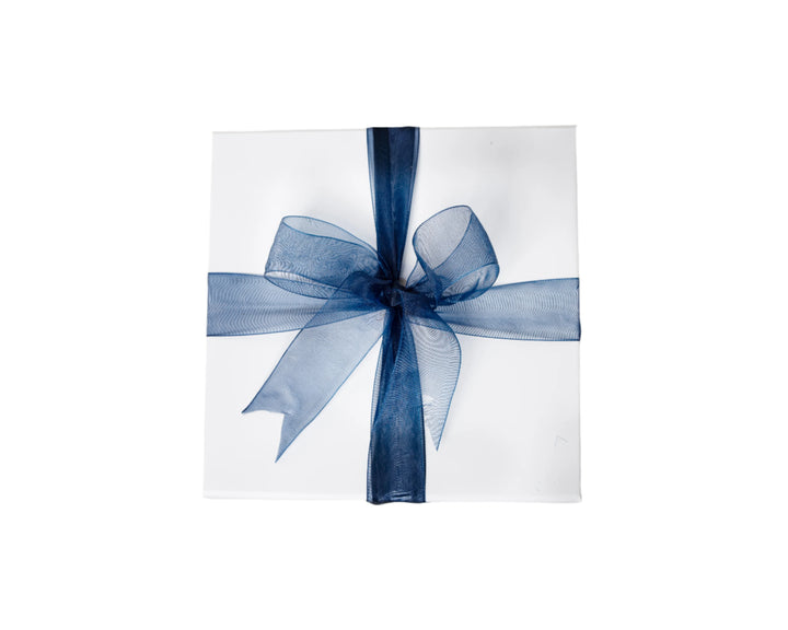 White gift box with sheer dark blue ribbon bow