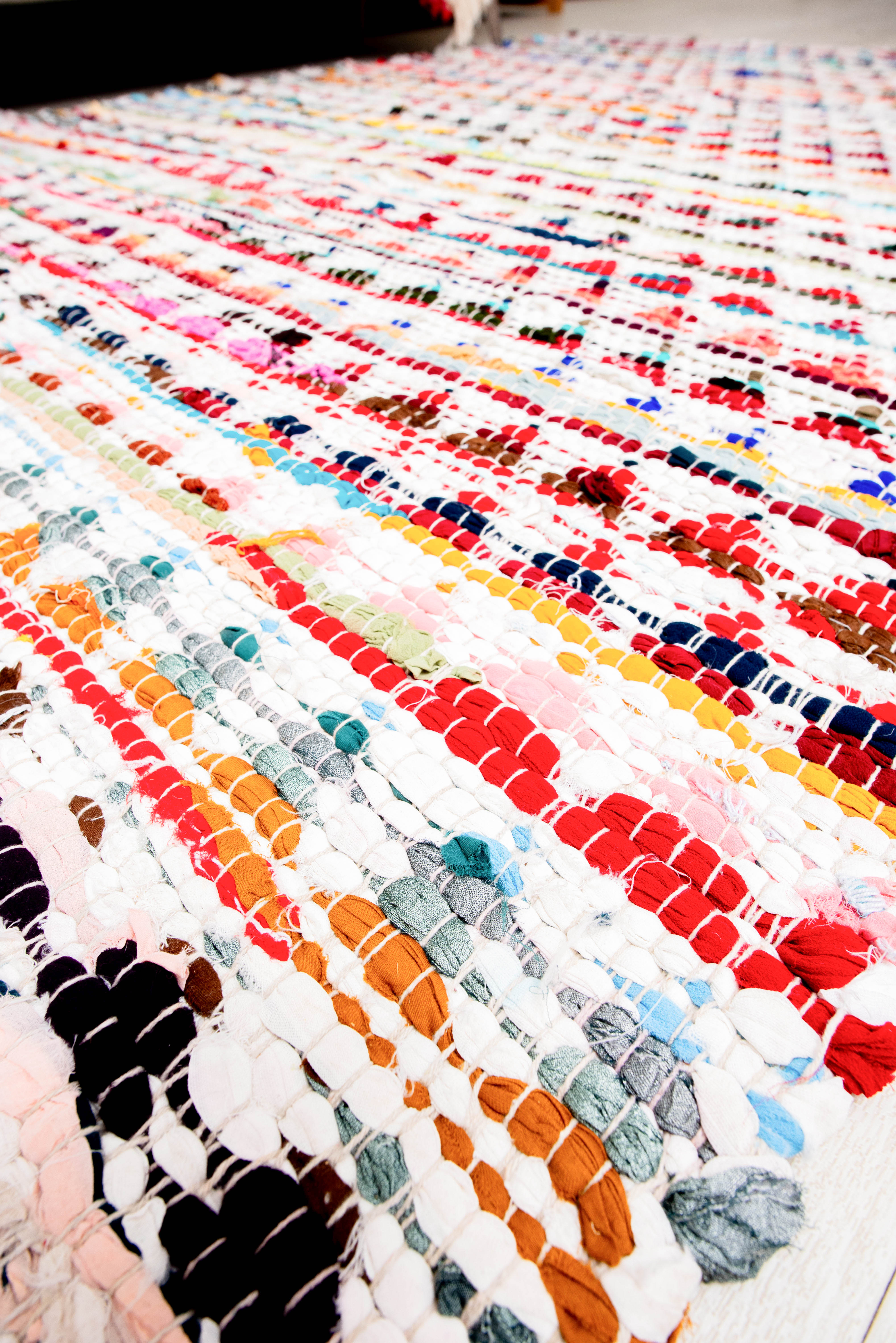 This Handicraft-Palace multicolor rug is a hand-woven and braided cotton chindi rug designed for home floor use. 