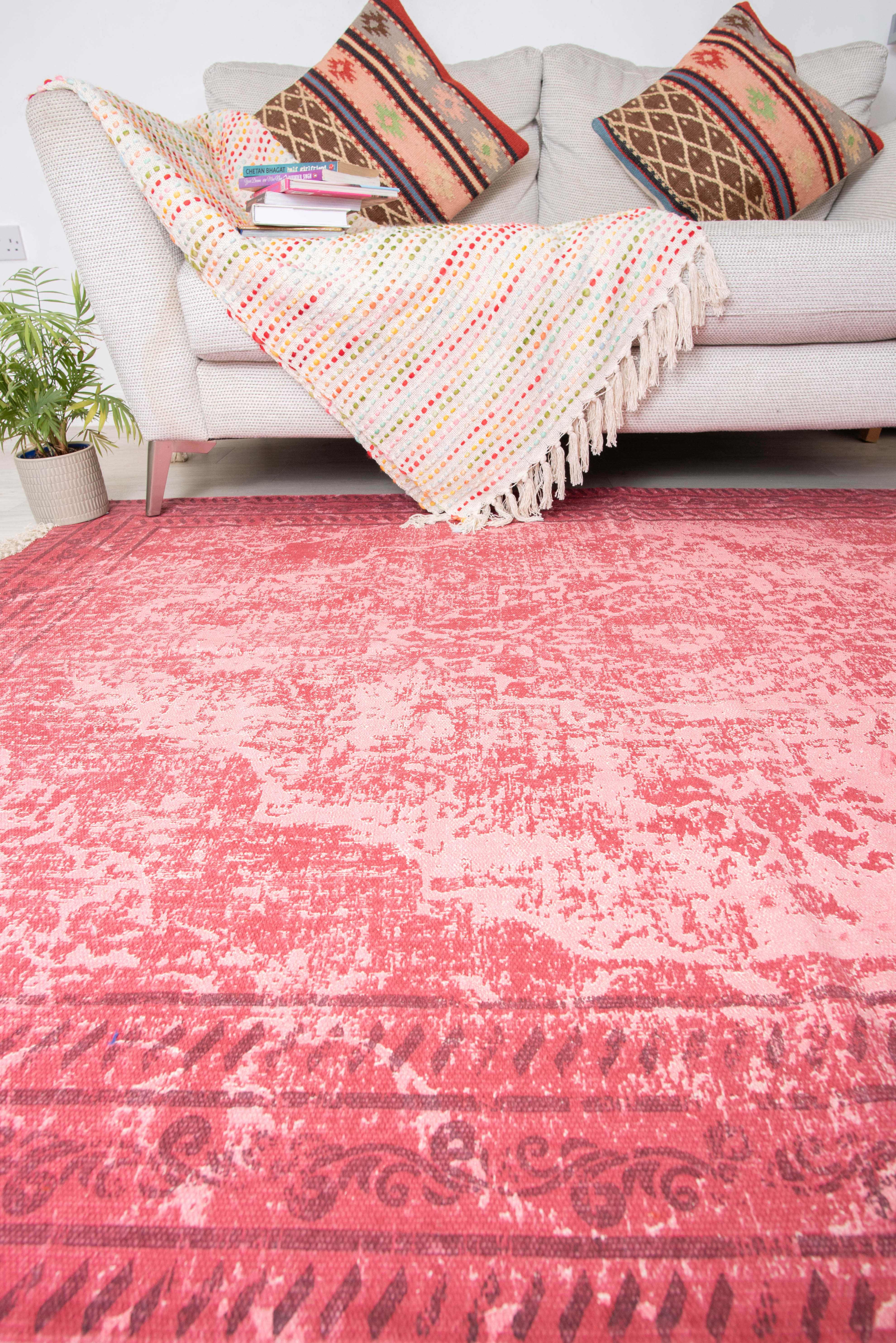 Based on similar items, this is a vintage-style fuchsia or pink area rug