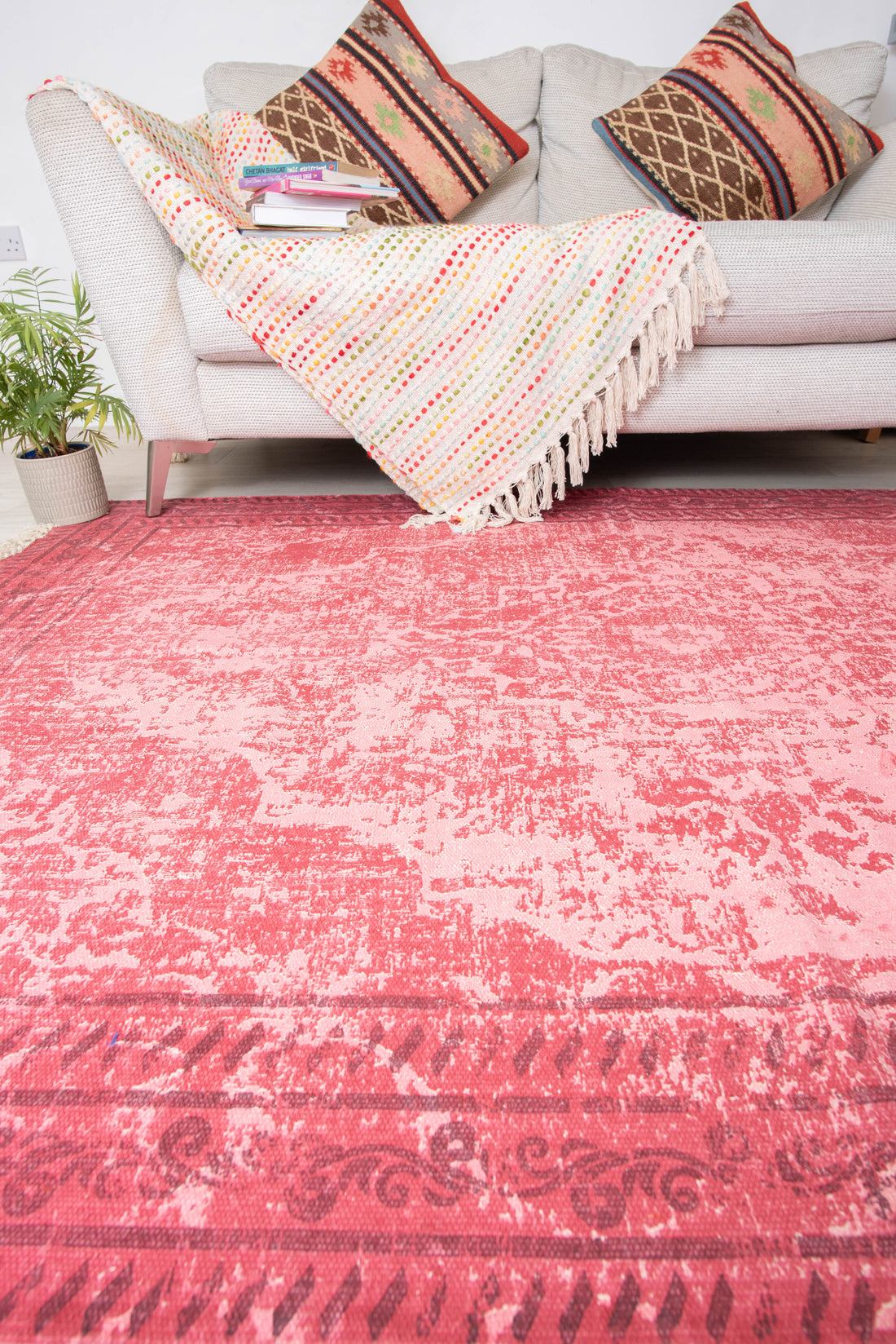 Based on similar items, this is a vintage-style fuchsia or pink area rug