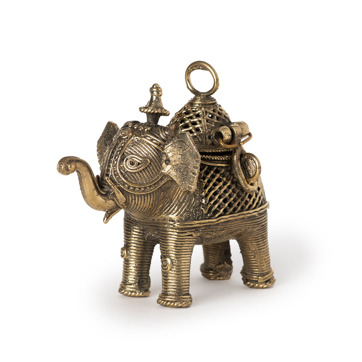 A handheld Dhokra brass elephant-shaped jewellery box with intricate details, featuring a removable lid on top.