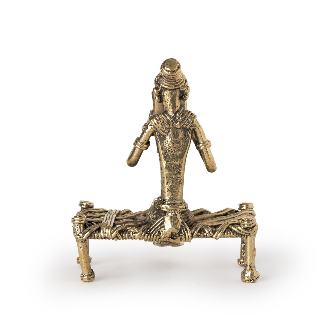 This is a handmade brass figurine in the Dhokra art style, which is a traditional Indian lost-wax casting technique. 