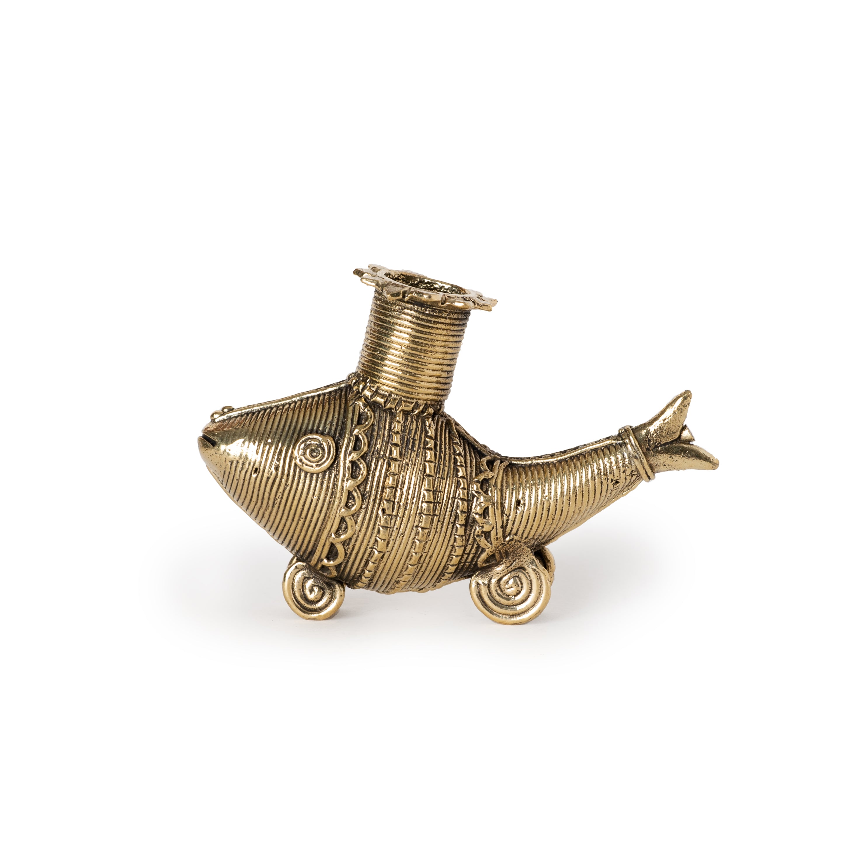 A gold-colored metal candle holder in the shape of a fish with a decorative pattern.