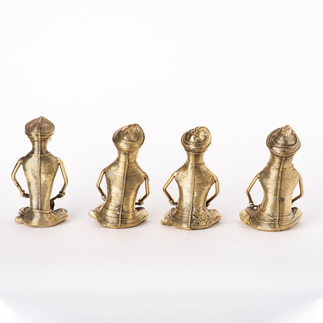 These are handmade brass figurines created using the traditional Dhokra art form, a 4000-year-old lost-wax casting technique. 
