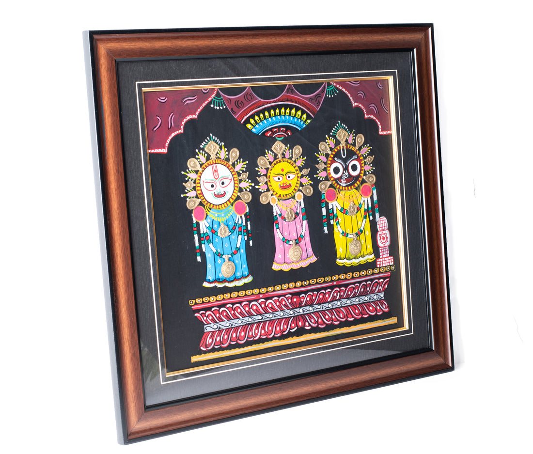 Framed artwork of Lord Jagannath, Balabhadra, and Subhadra