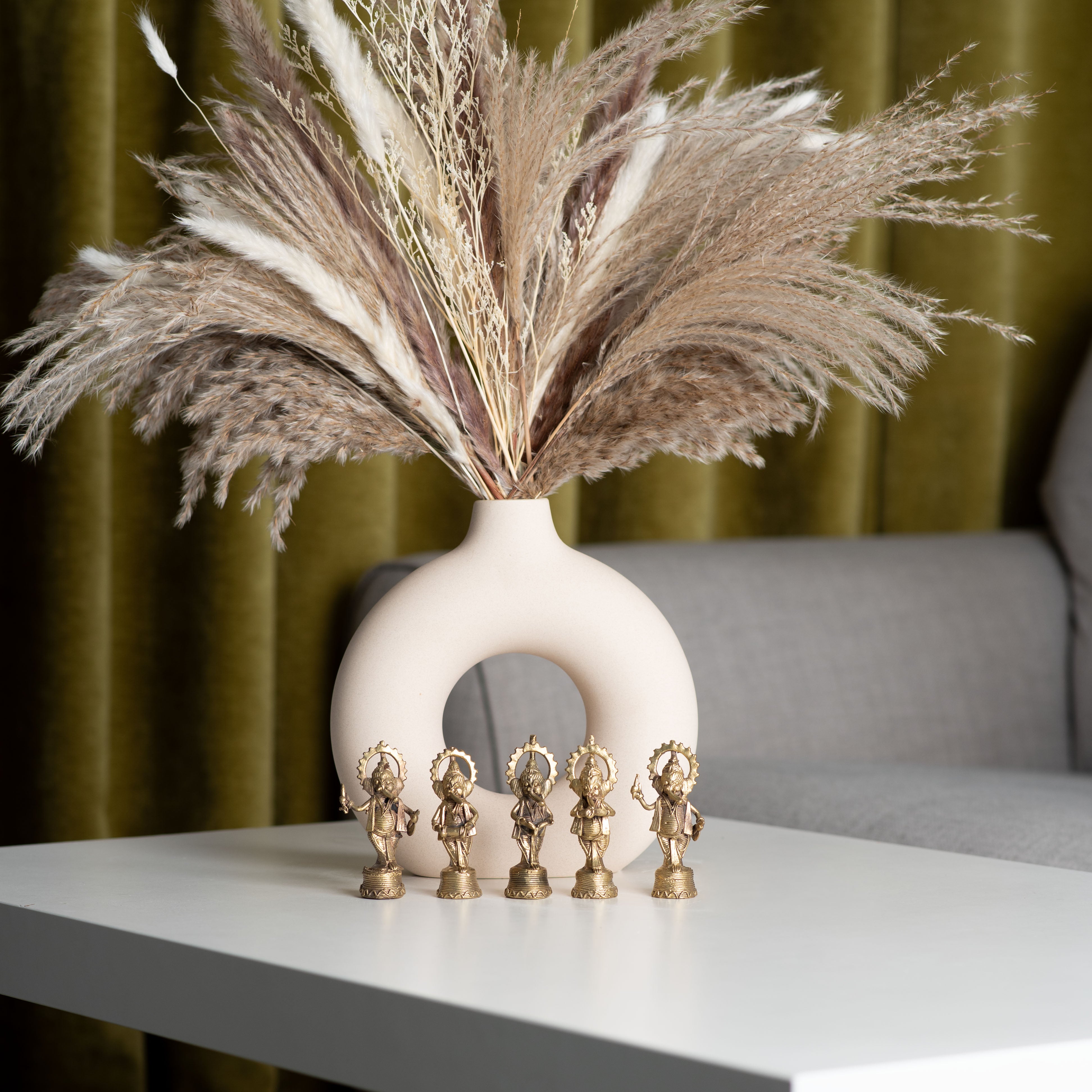Decorative tabletop arrangement with golden figurines