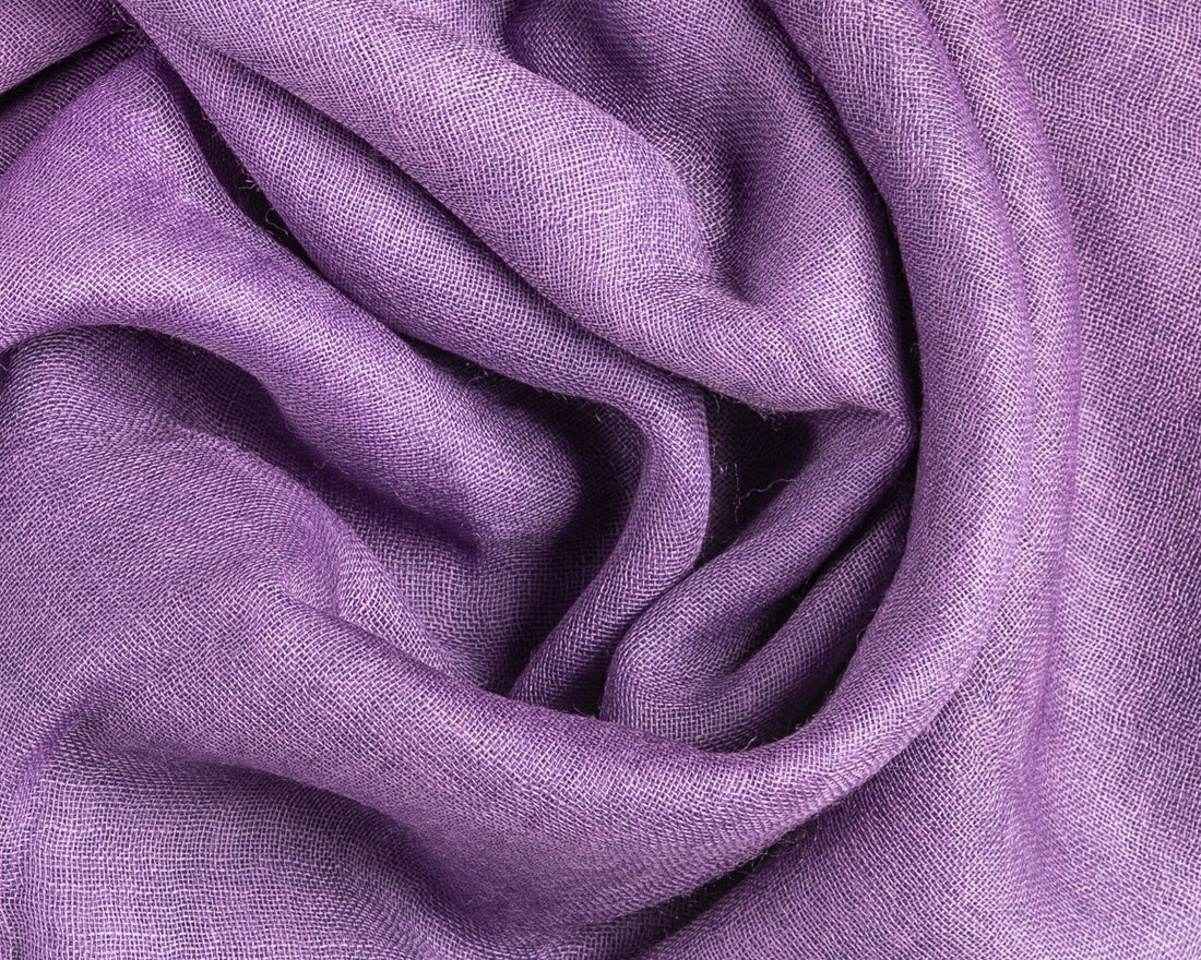 High-quality fabric in rich purple color with visible fibers