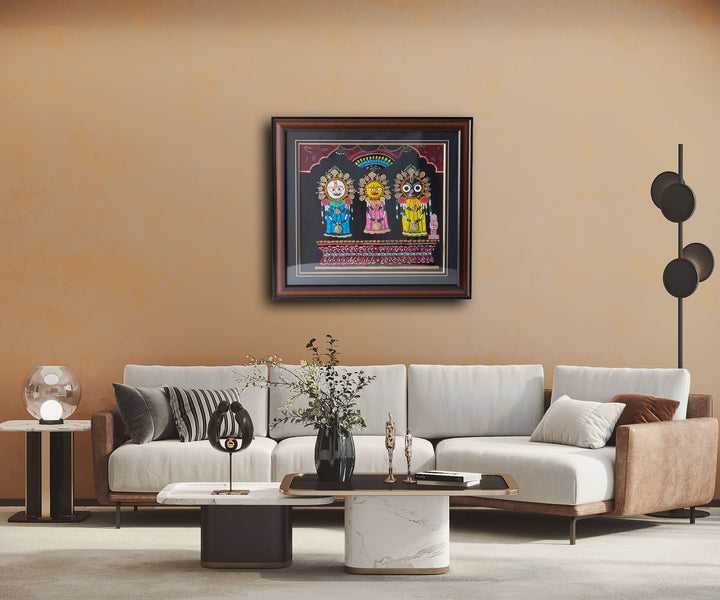 A framed artwork featuring three cartoon characters in a vibrant color scheme, displayed on a wall above a modern sofa set in a minimalist living room.