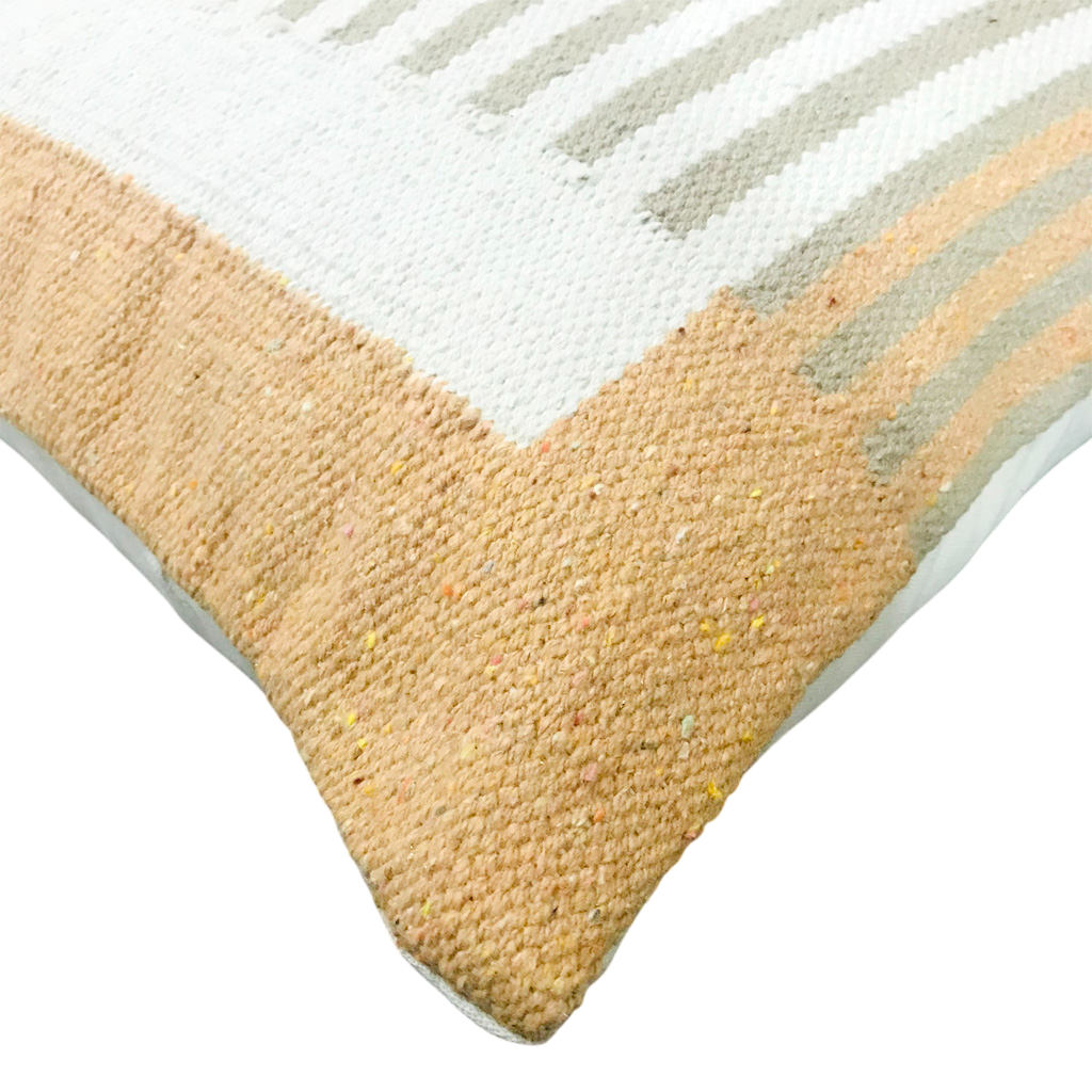 Close-up of a textured rug with geometric pattern on a white background