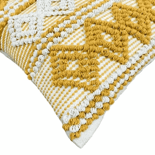 Close-up of a yellow and white textured fabric with geometric pattern