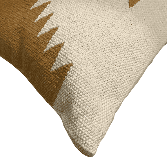 Close-up of a textured pillow with geometric pattern on a white background