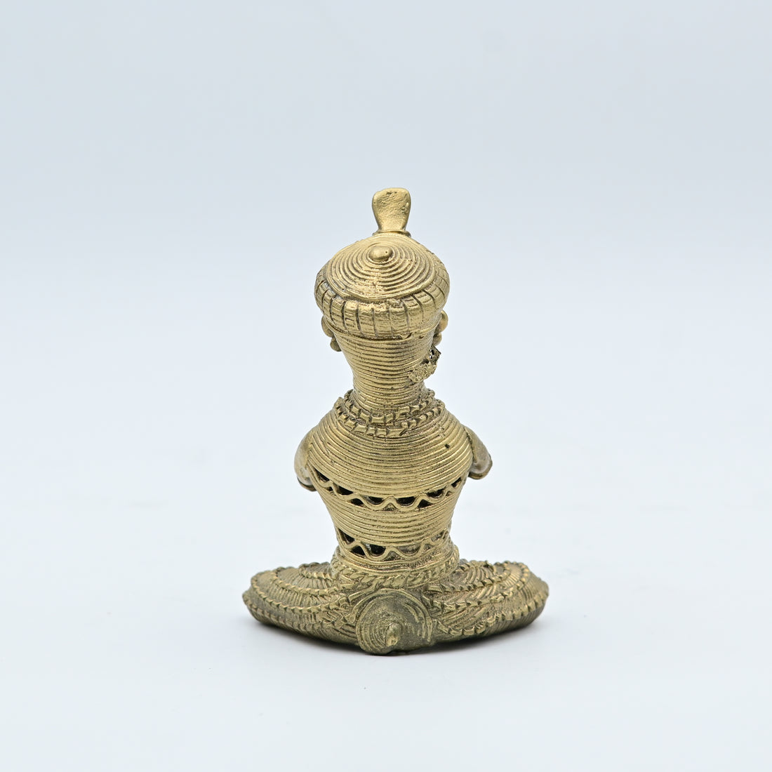 This item is a traditional Dhokra brass figurine, a form of tribal art from India created using the ancient lost-wax casting technique. 