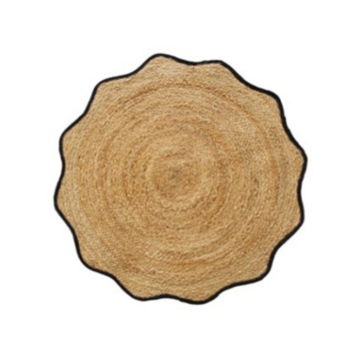 A round shaped, braided jute rug with a black border.