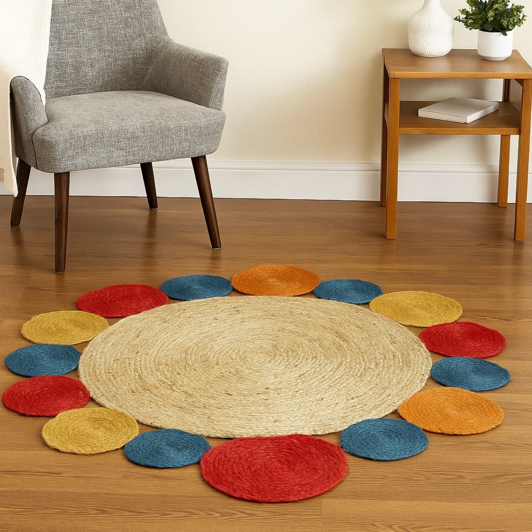 Round beige rug with multicolored circular pads on a wooden floor, with a gray chair and wooden side table in the background.