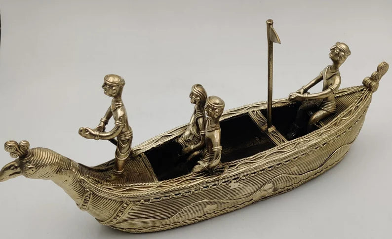 This item is a traditional Dhokra art brass boat showpiece, handcrafted using the ancient lost-wax casting technique. 