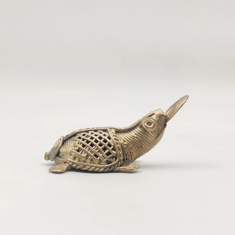 This item is a 4-inch "Coin Catching Sea Turtle" figurine handcrafted using the traditional Dhokra brass metal casting technique. 