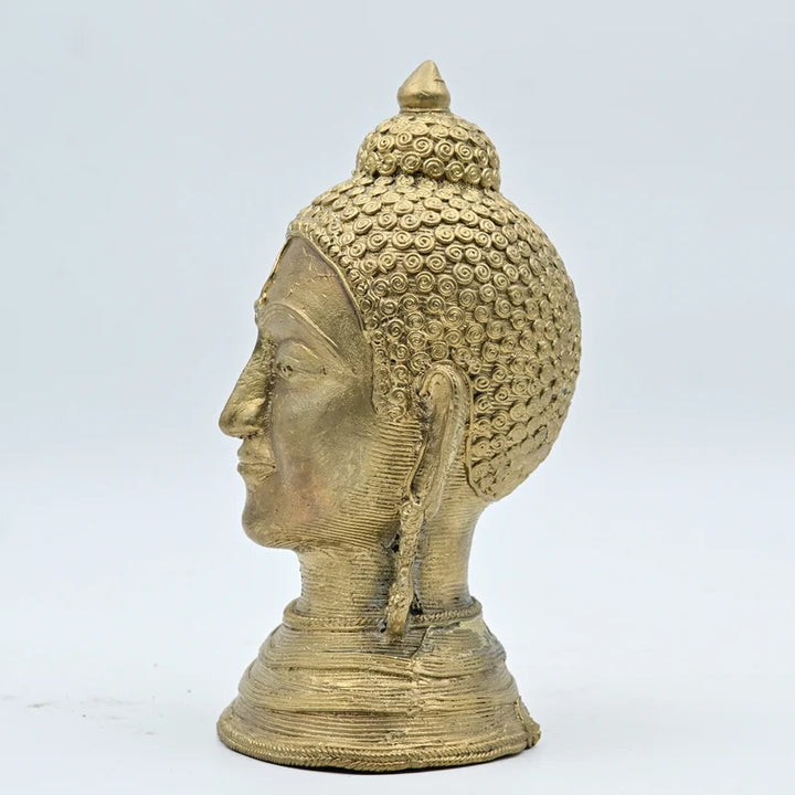 This item is a brass Buddha head statue often used for home decor and meditation spaces. 