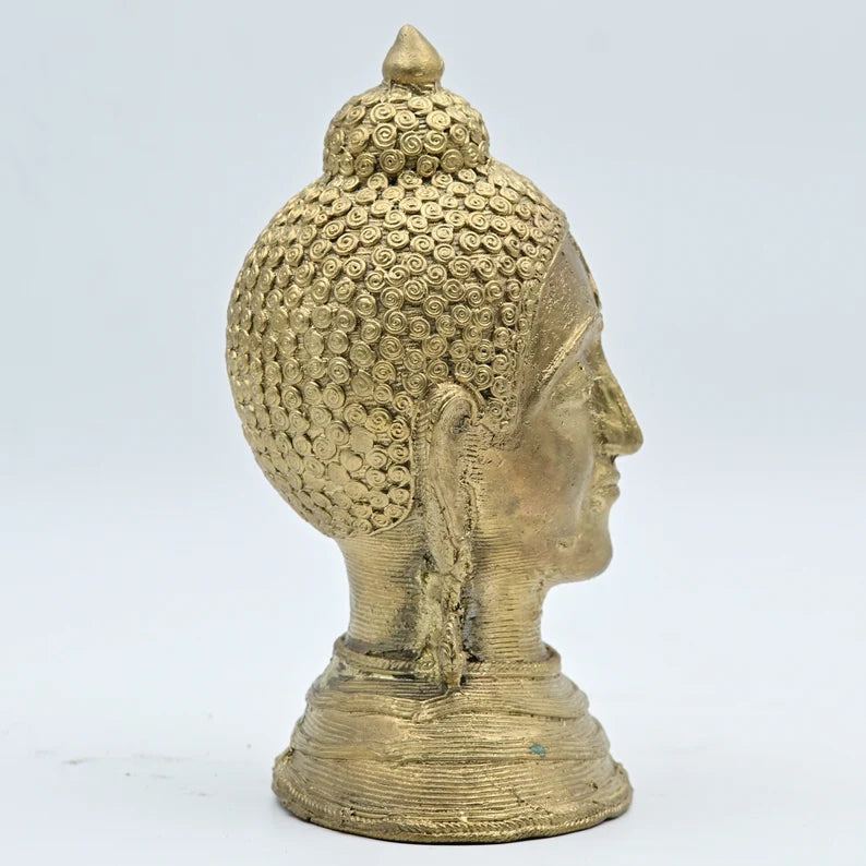 This item is a decorative Golden Brass Buddha Head Statue. 