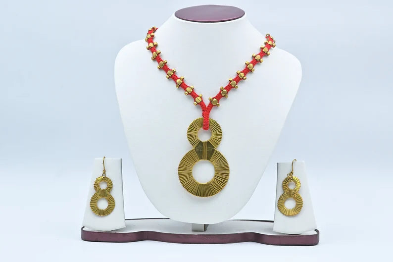 This item is a "Lucky Eight" tribal necklace and earrings set, handcrafted using traditional Dhokra techniques. 