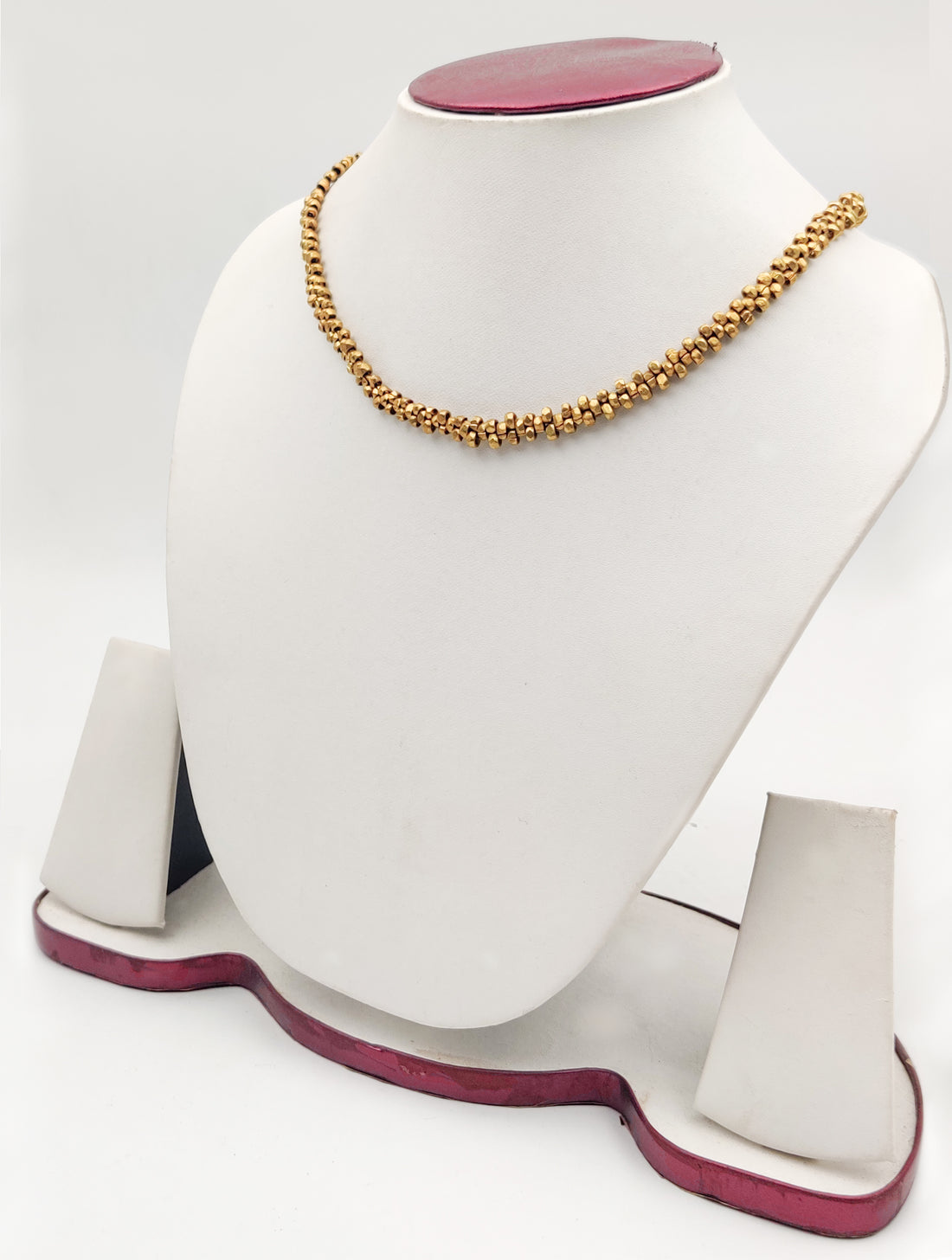 Elegant gold chain necklace on mannequin display