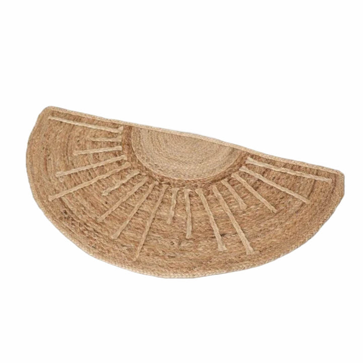 Half-circle jute rug with sunburst pattern on a white background